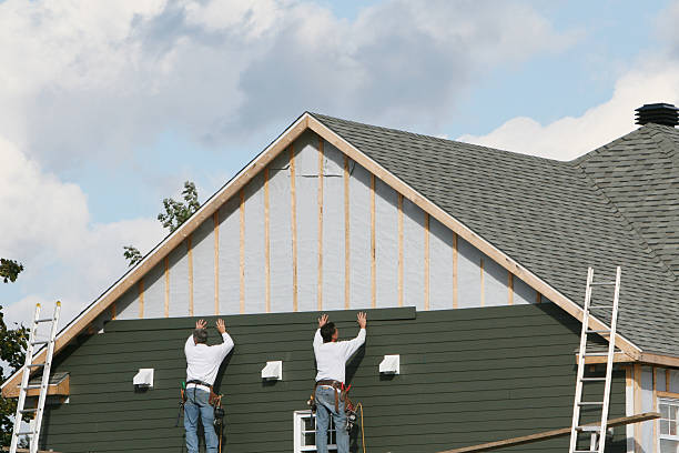 Professional Storm Damage Siding Repair technician working in Lakeland, MN